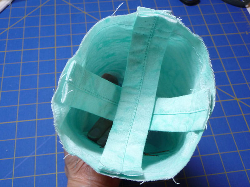 A white water bottle with a measuring tape around it